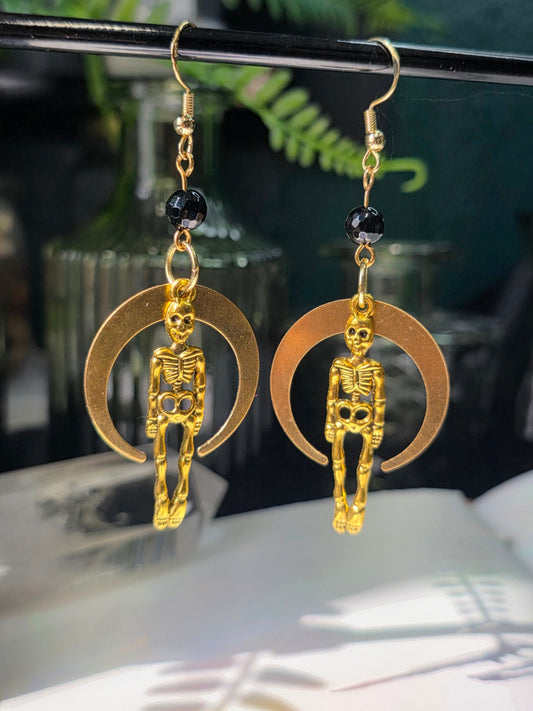 Skeletons and Downward Large Moon in Round Faceted Obsidian Danse Macabre